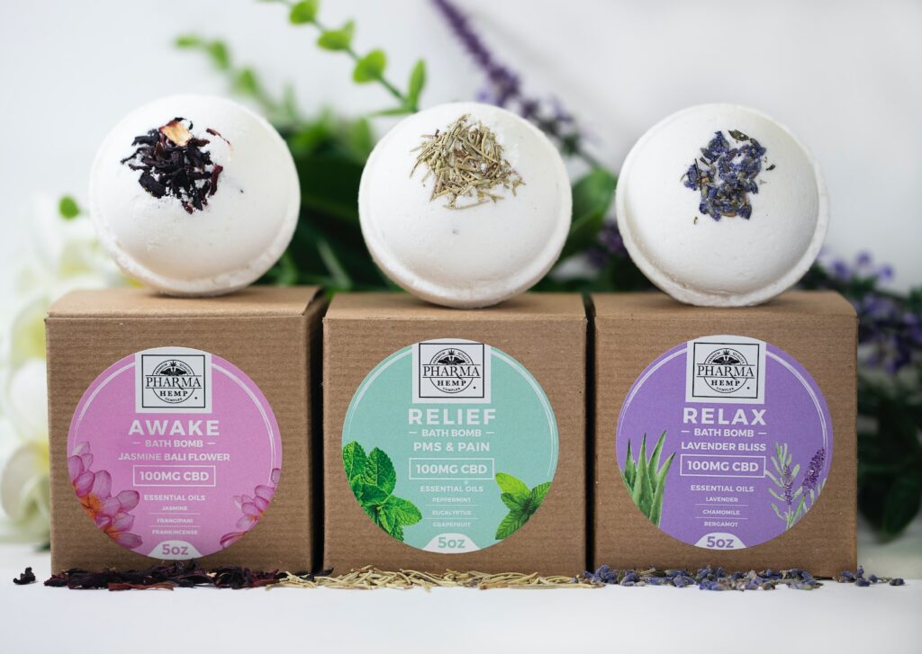 three assorted-label bath bombs with boxes